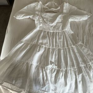 white mini open back dress